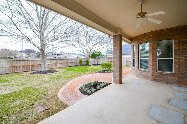 view of patio / terrace with a fenced backyard, a residential view, and ceiling fan