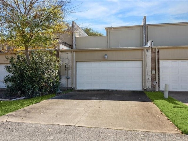 garage featuring driveway