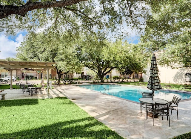 pool with a patio, a yard, fence, and a pergola