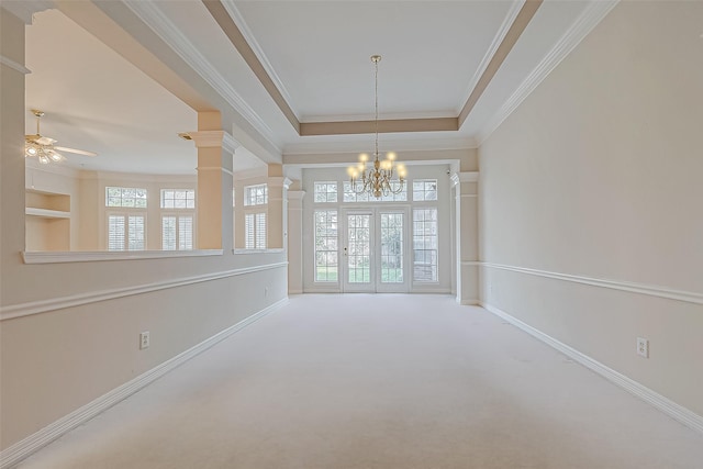 empty room featuring ornamental molding, carpet, decorative columns, and baseboards