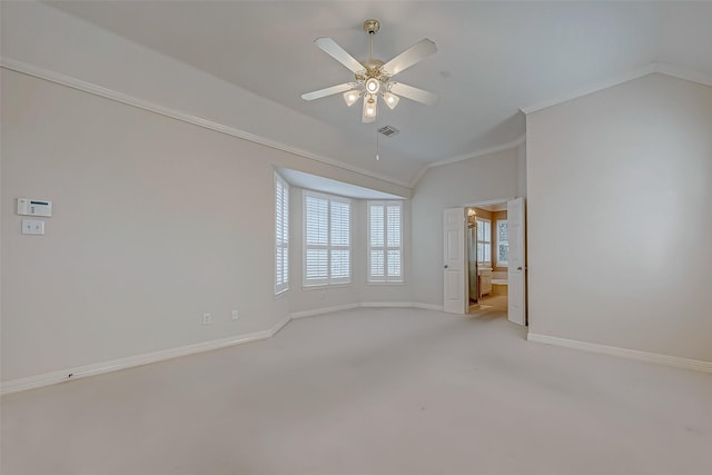 empty room featuring baseboards, visible vents, a ceiling fan, light colored carpet, and ornamental molding