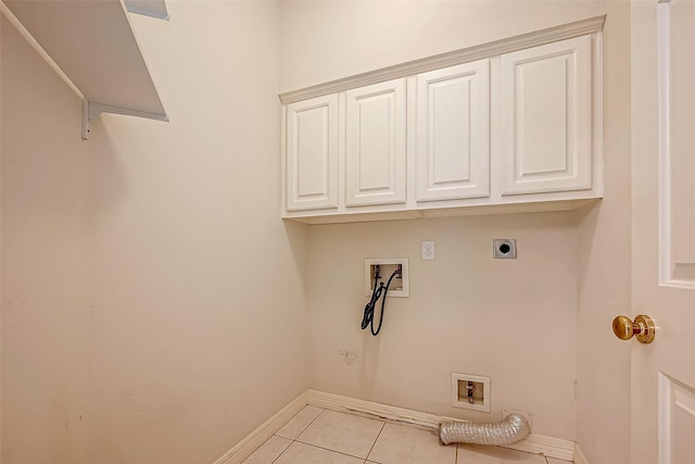 laundry area with light tile patterned floors, washer hookup, cabinet space, and electric dryer hookup