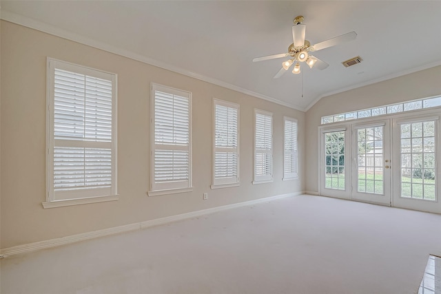 unfurnished sunroom with lofted ceiling, visible vents, and a ceiling fan