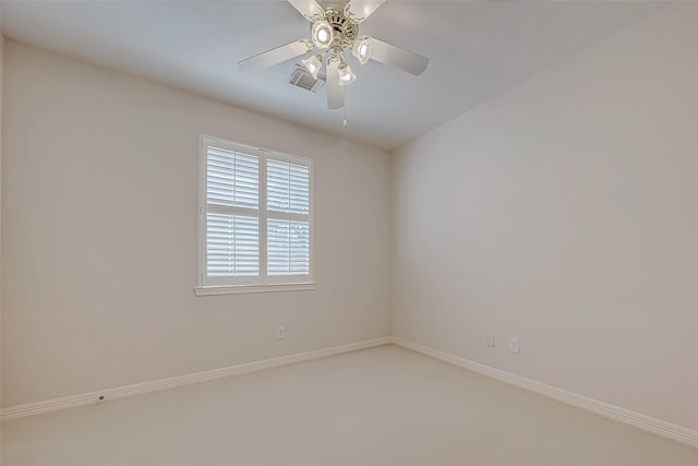 unfurnished room featuring baseboards, visible vents, and a ceiling fan