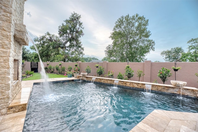 view of swimming pool with a fenced backyard