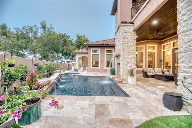 view of pool with a fenced in pool, ceiling fan, a fenced backyard, a patio area, and an outdoor living space with a fireplace