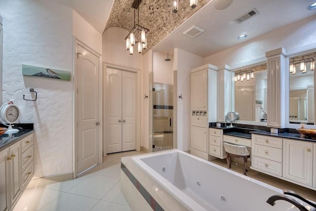 bathroom with visible vents, a tub with jets, tile patterned flooring, vanity, and a shower stall