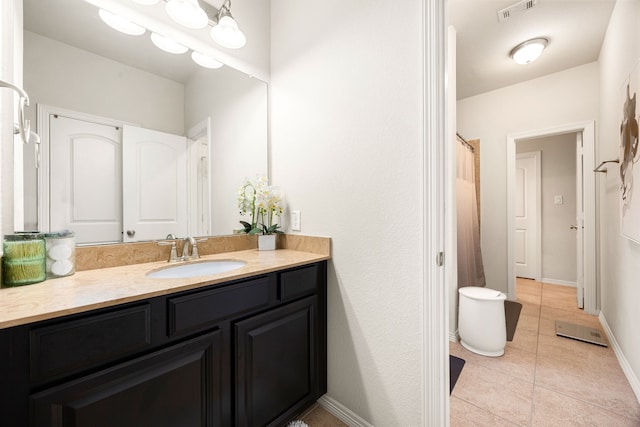 full bath with visible vents, an inviting chandelier, vanity, tile patterned flooring, and baseboards