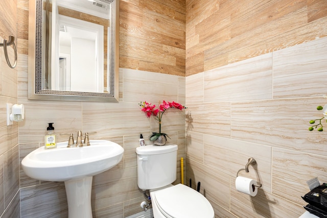 bathroom with visible vents and toilet