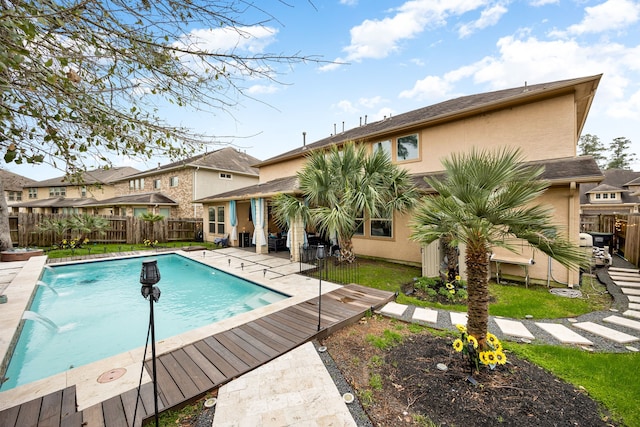 view of swimming pool featuring fence and a fenced in pool