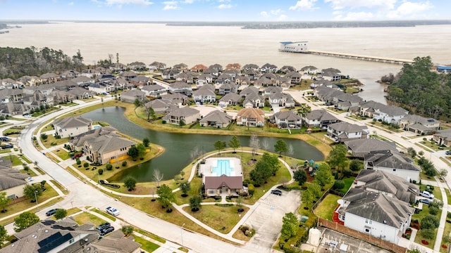 bird's eye view featuring a water view and a residential view