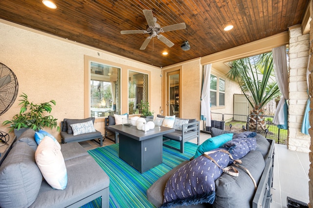 view of patio / terrace with an outdoor living space and a ceiling fan