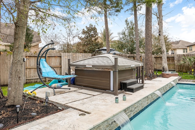 view of patio featuring a fenced in pool, a fenced backyard, and a jacuzzi