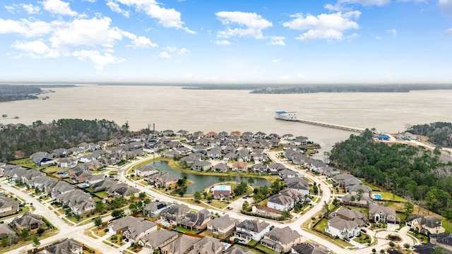 aerial view featuring a residential view and a water view