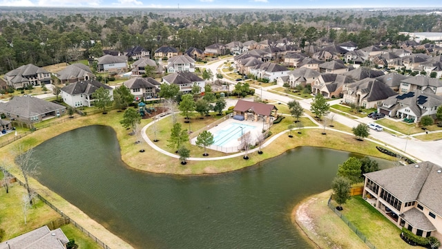 bird's eye view featuring a water view and a residential view