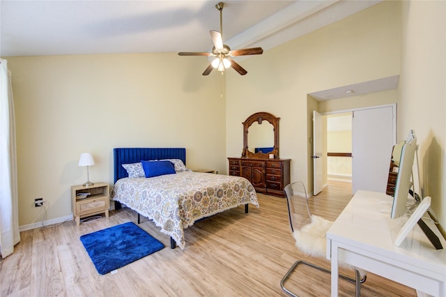 bedroom with high vaulted ceiling, ceiling fan, baseboards, and wood finished floors