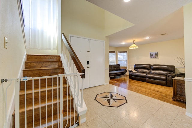 interior space featuring tile patterned flooring, visible vents, and recessed lighting