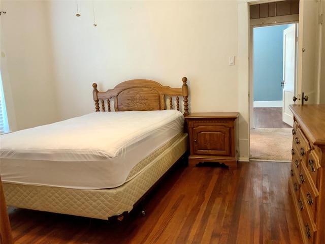 bedroom featuring dark wood-style floors