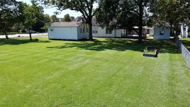 view of yard featuring a garden and fence