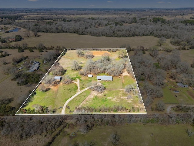 birds eye view of property featuring a rural view