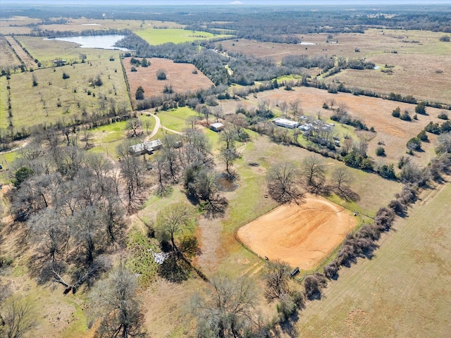 birds eye view of property featuring a water view and a rural view