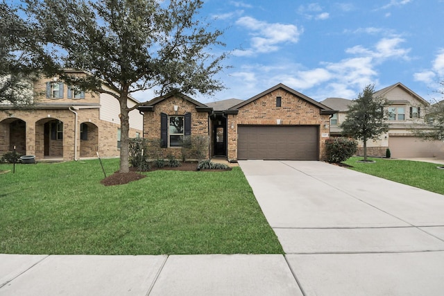 view of front facade featuring an attached garage, concrete driveway, brick siding, and a front yard