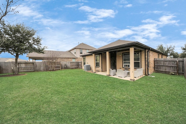 back of house featuring a fenced backyard, a lawn, and central AC