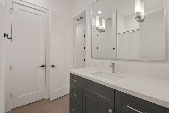 full bathroom with recessed lighting, vanity, and a shower with curtain