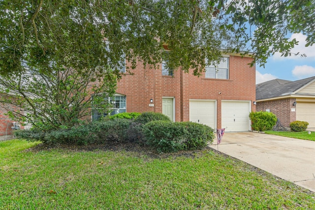 view of front of home with a garage, driveway, brick siding, and a front lawn