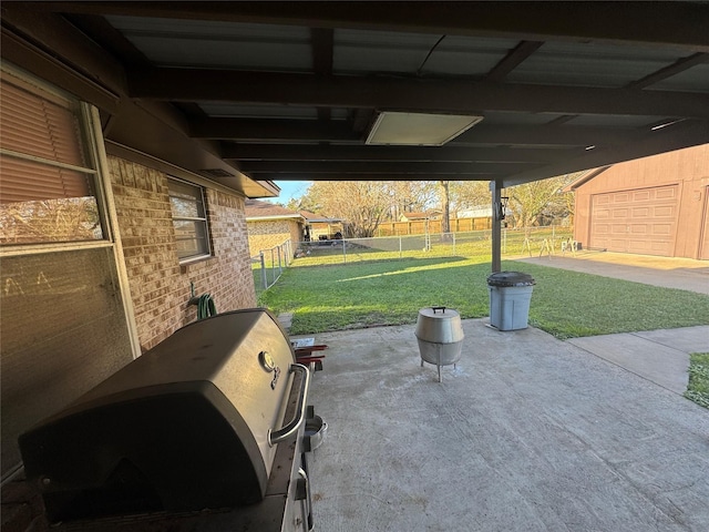 view of patio with area for grilling and fence