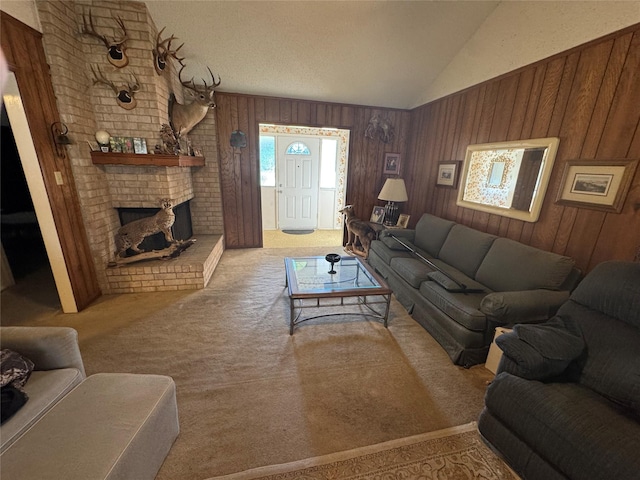 living room featuring light carpet, vaulted ceiling, wooden walls, and a fireplace