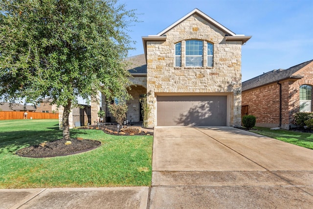 view of front of property featuring driveway, stone siding, a garage, and a front lawn