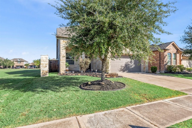 obstructed view of property featuring driveway, stone siding, fence, and a front yard