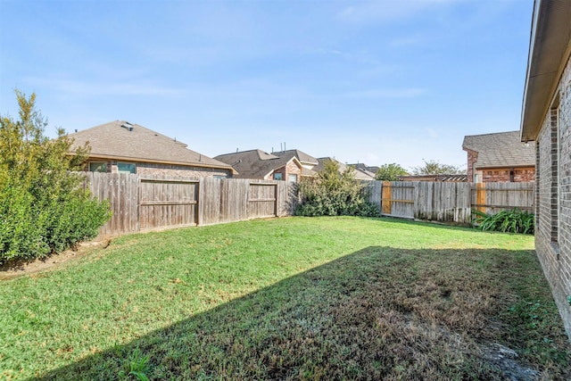 view of yard featuring a fenced backyard