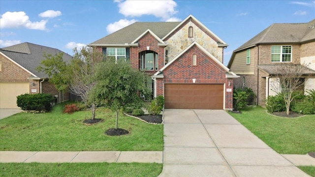 traditional home with brick siding, an attached garage, a front yard, stone siding, and driveway