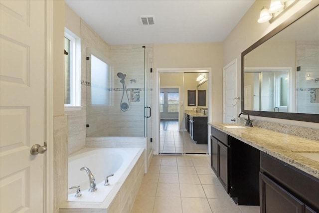 full bath with a sink, visible vents, a shower stall, a bath, and tile patterned floors