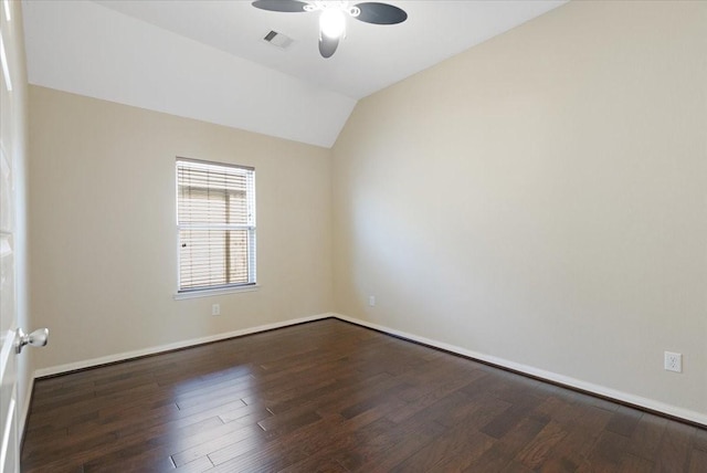 spare room with visible vents, baseboards, dark wood finished floors, lofted ceiling, and ceiling fan