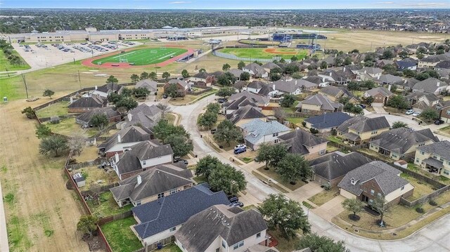 birds eye view of property with a residential view