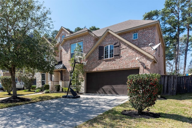 view of front facade featuring a garage, brick siding, concrete driveway, fence, and a front yard