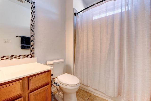 bathroom featuring vanity, toilet, and tile patterned floors