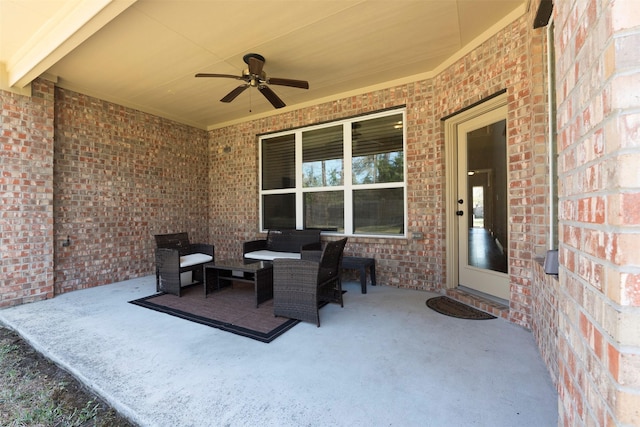 view of patio with an outdoor living space and a ceiling fan