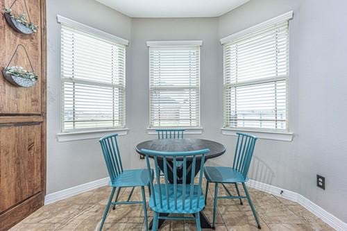 dining room with baseboards