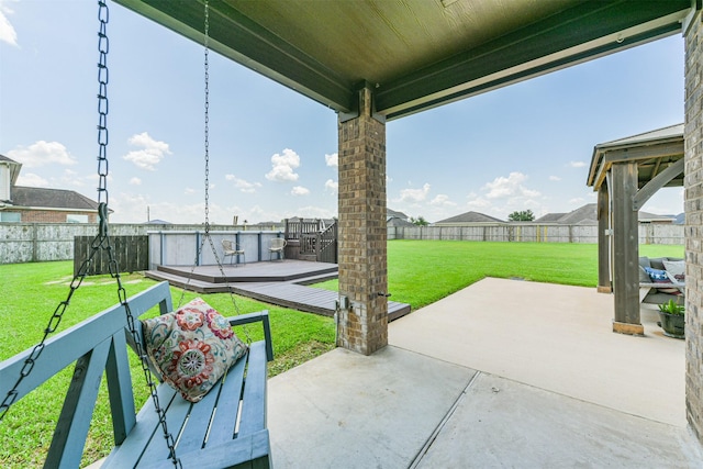 view of patio with a fenced backyard and a wooden deck