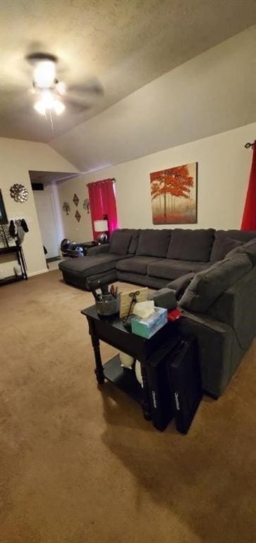 carpeted living room with lofted ceiling