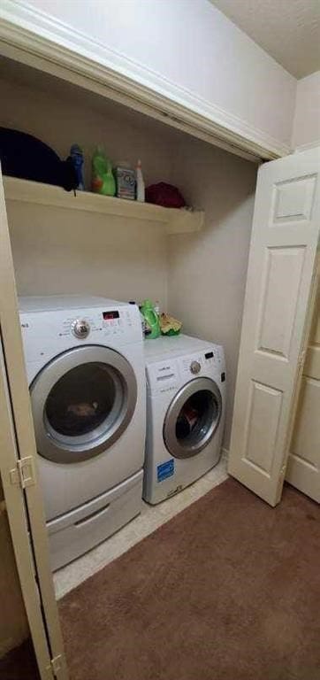 laundry area with laundry area and independent washer and dryer