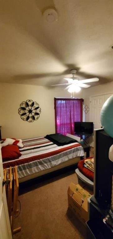 bedroom with ceiling fan and carpet floors