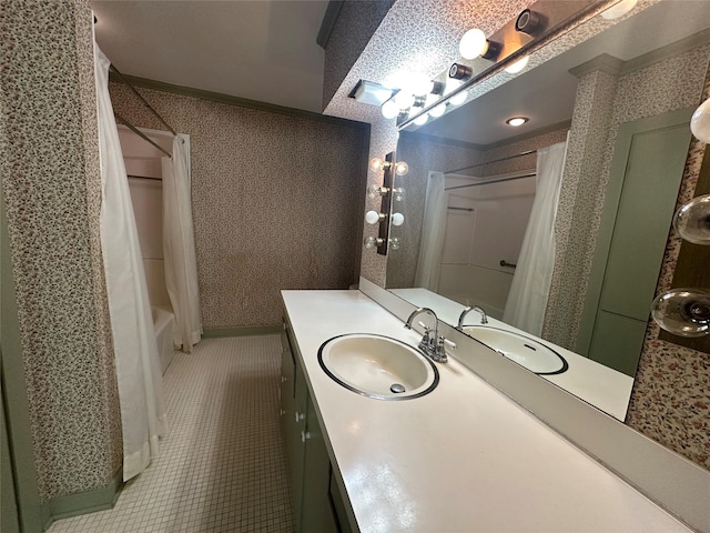 bathroom with shower / tub combo, vanity, tile patterned flooring, and wallpapered walls