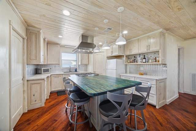 kitchen with open shelves, white appliances, island exhaust hood, light countertops, and pendant lighting