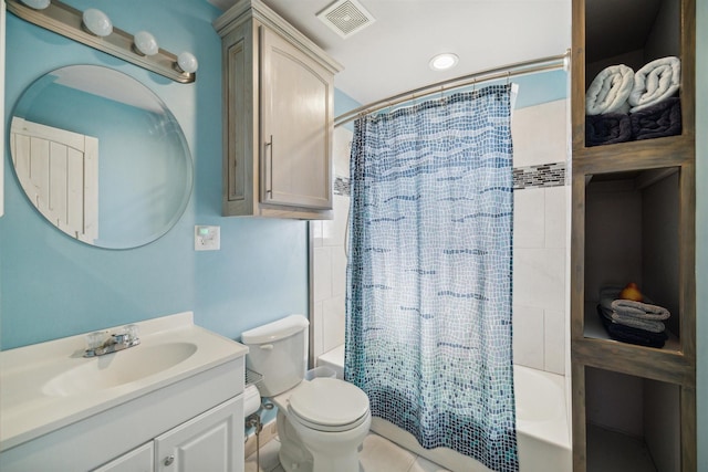 bathroom featuring toilet, vanity, visible vents, and shower / tub combo with curtain