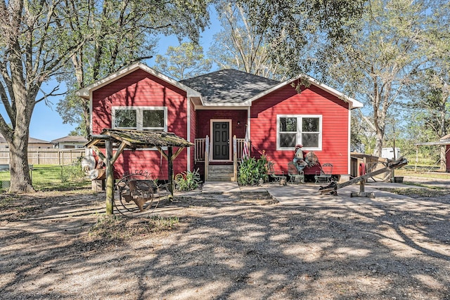 view of front of home with fence